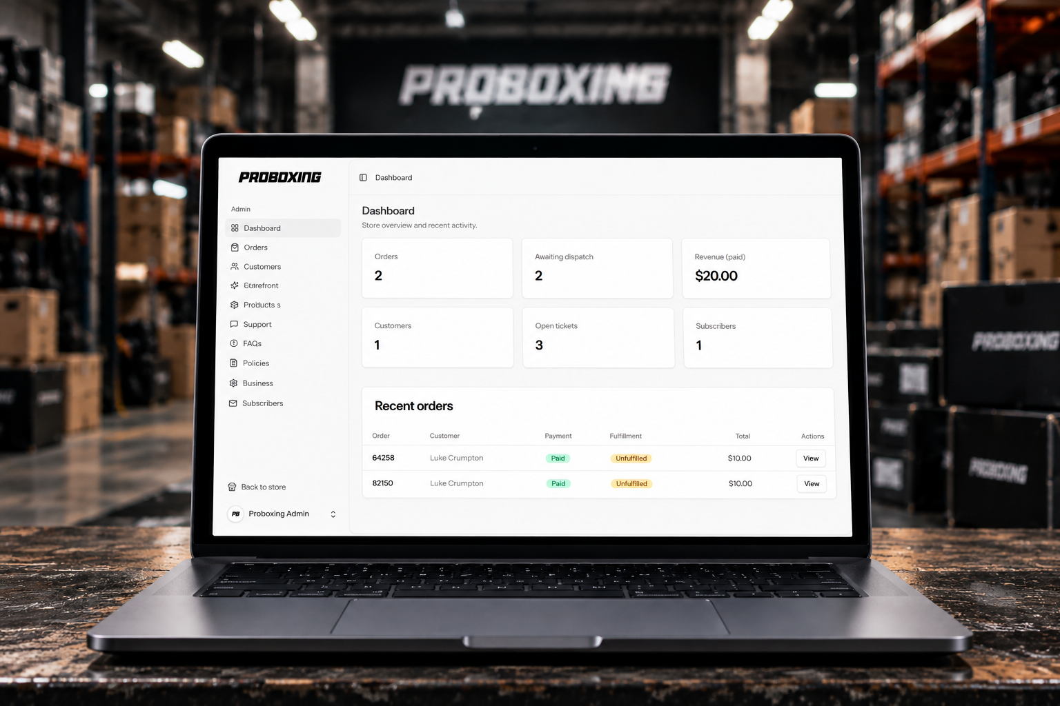 Proboxing admin dashboard on a laptop, built by Coded